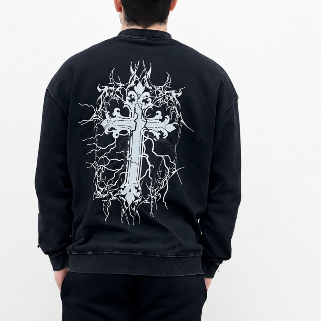 Person wearing a black sweatshirt with a white graphic design on the back against a white background
