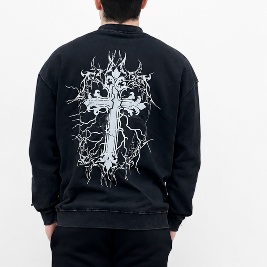 Person wearing a black sweatshirt with a white graphic design on the back against a white background